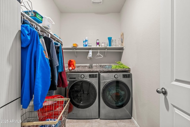 washroom featuring light tile patterned floors and independent washer and dryer