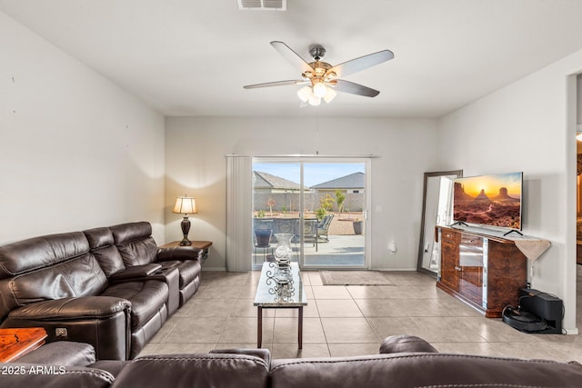 tiled living room featuring ceiling fan