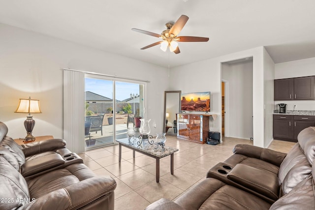 living room with light tile patterned floors and ceiling fan