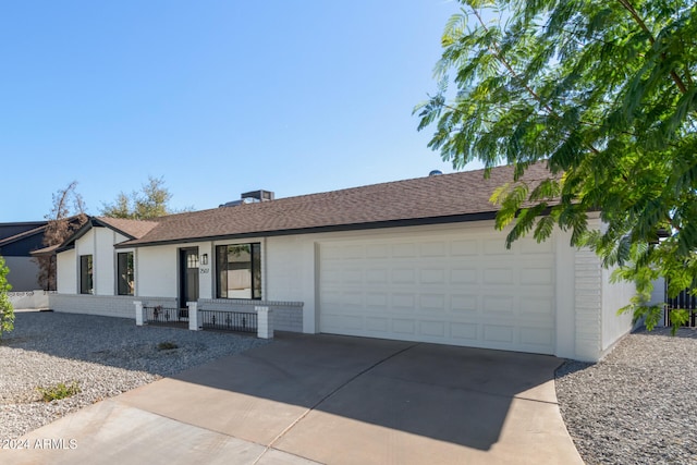 ranch-style home featuring a garage