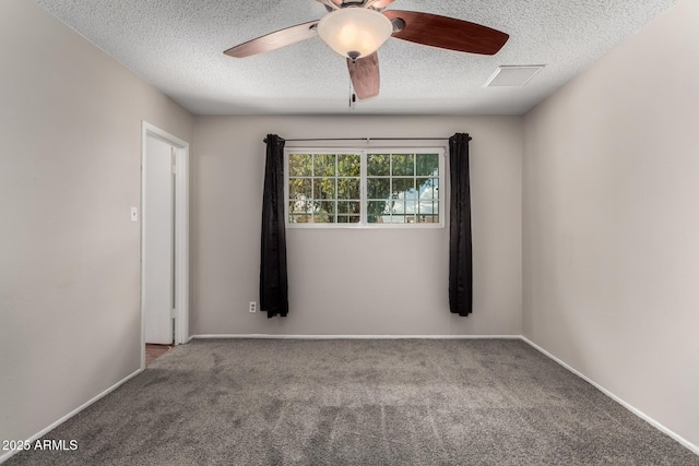 unfurnished room with a textured ceiling, visible vents, carpet floors, and ceiling fan