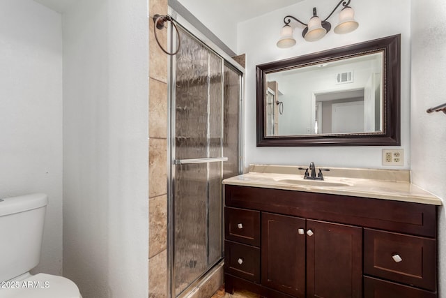 full bath featuring visible vents, a shower stall, toilet, and vanity