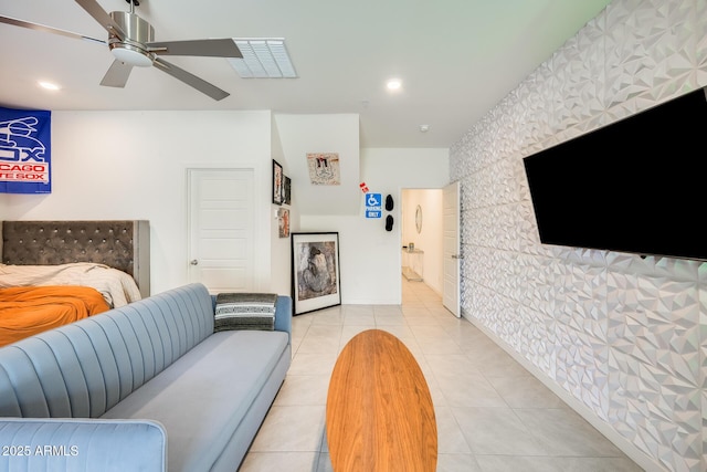 bedroom with light tile patterned floors, ceiling fan, recessed lighting, an accent wall, and visible vents