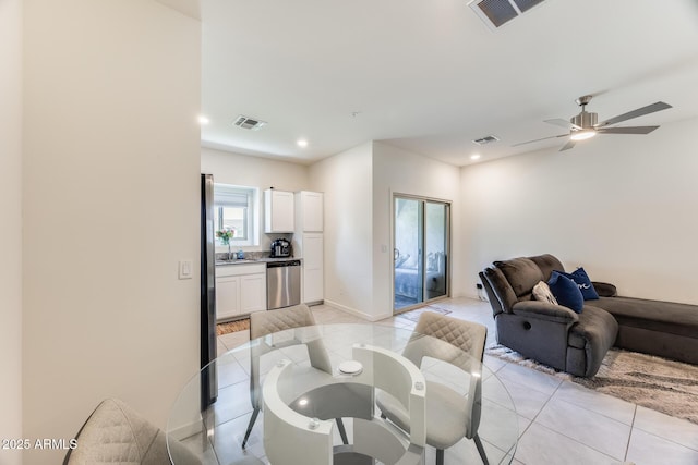 living room featuring light tile patterned floors, visible vents, and recessed lighting