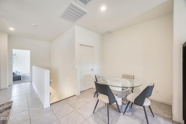 dining area with visible vents, baseboards, and light tile patterned flooring