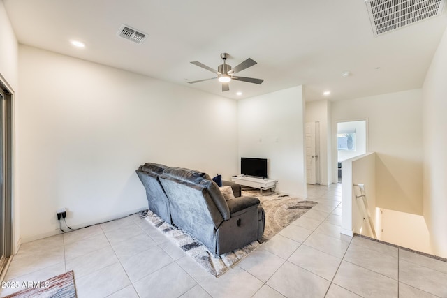 living area featuring light tile patterned floors, visible vents, a ceiling fan, and recessed lighting