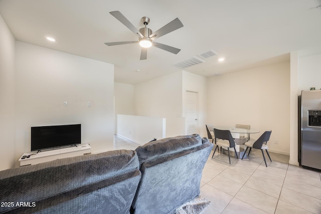 living area featuring a ceiling fan, recessed lighting, visible vents, and light tile patterned floors