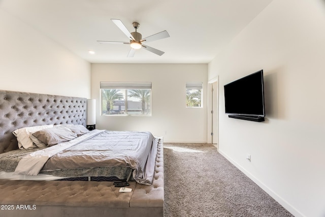 bedroom featuring ceiling fan, carpet floors, and baseboards