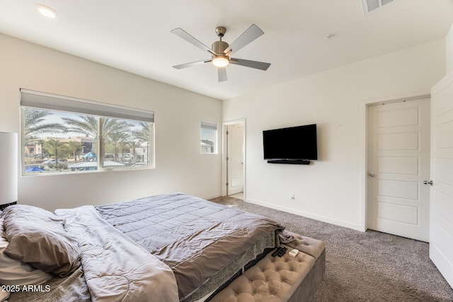 bedroom featuring carpet floors, visible vents, baseboards, and ceiling fan