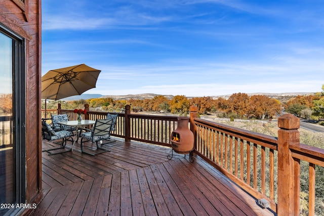 wooden terrace with a mountain view