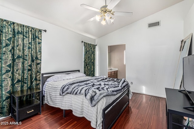 8566 N 108th Ln, Peoria, AZ 85345 - bedroom with vaulted ceiling, wood finished floors, ceiling fan, and ensuite bath