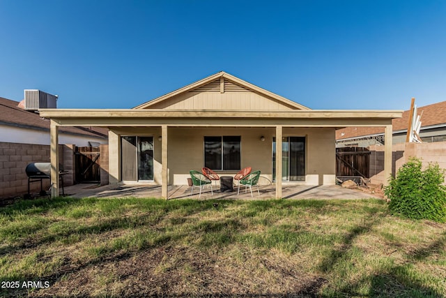 8566 N 108th Ln, Peoria, AZ 85345 - rear view of property featuring a patio area and concrete block siding
