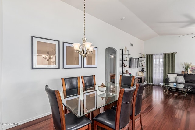 8566 N 108th Ln, Peoria, AZ 85345 - dining space with vaulted ceiling, a chandelier, dark wood-type flooring, arched walkways, and ceiling fan