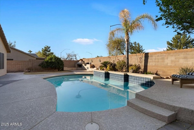 view of swimming pool featuring a patio