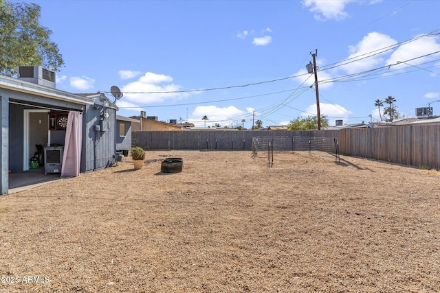 view of yard with central AC