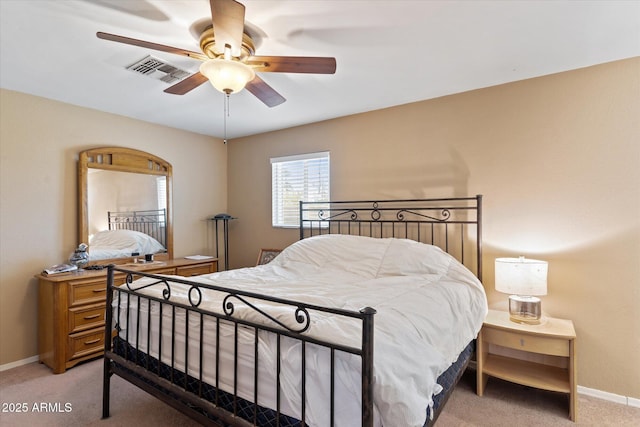 bedroom with ceiling fan and light colored carpet