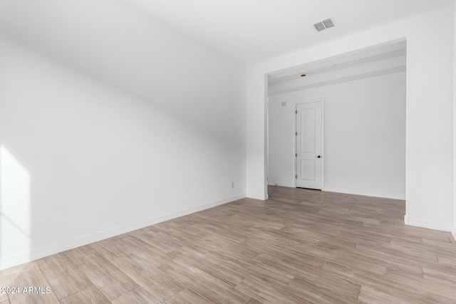 spare room featuring light wood-type flooring