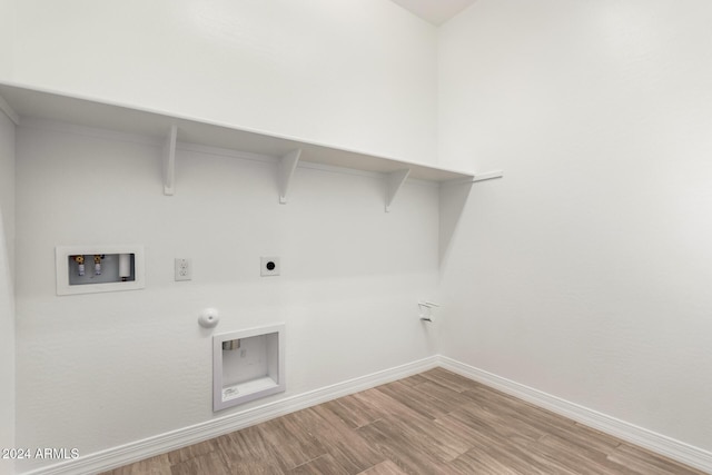 laundry room with electric dryer hookup, hookup for a gas dryer, wood-type flooring, and hookup for a washing machine