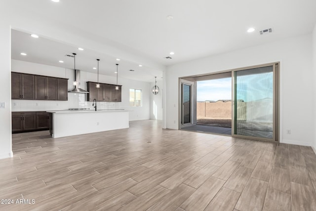 unfurnished living room with sink