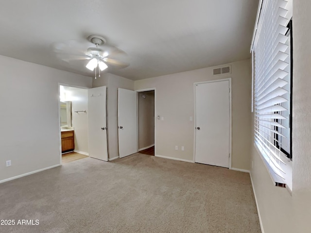16635 N Cave Creek Rd Unit 232, Phoenix, AZ 85032 - unfurnished bedroom featuring visible vents, carpet, ensuite bath, and baseboards