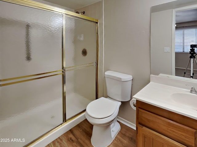 16635 N Cave Creek Rd Unit 232, Phoenix, AZ 85032 - full bathroom featuring a shower stall, wood finished floors, vanity, baseboards, and toilet