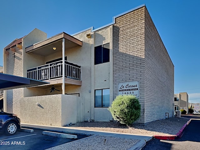 16635 N Cave Creek Rd Unit 232, Phoenix, AZ 85032 - view of building exterior featuring uncovered parking