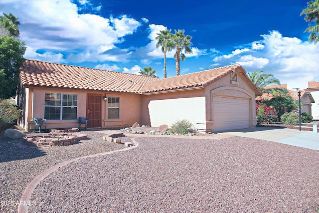 5941 W Venus Way, Chandler, AZ 85226 - view of front of house featuring a garage, stucco siding, a tile roof, and concrete driveway