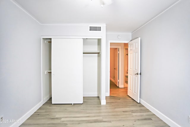 5941 W Venus Way, Chandler, AZ 85226 - unfurnished bedroom with light wood-style floors, a closet, baseboards, and ornamental molding