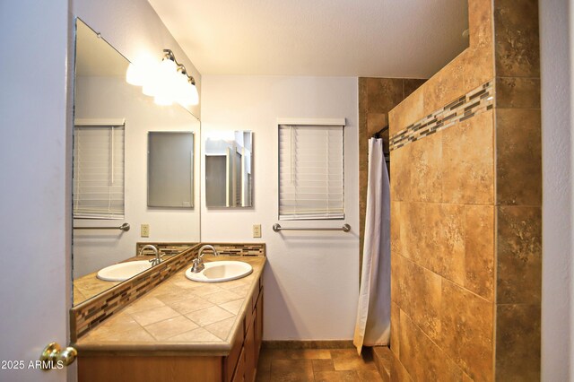 5941 W Venus Way, Chandler, AZ 85226 - full bathroom with vanity, a tile shower, and baseboards