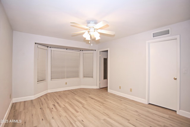 5941 W Venus Way, Chandler, AZ 85226 - unfurnished room with a ceiling fan, light wood-style floors, and baseboards