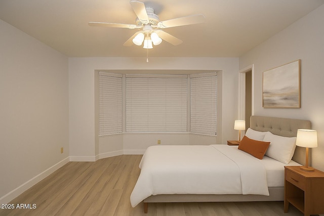 5941 W Venus Way, Chandler, AZ 85226 - bedroom with light wood finished floors, baseboards, and a ceiling fan