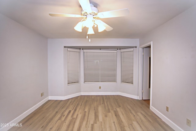 5941 W Venus Way, Chandler, AZ 85226 - unfurnished room with wood finished floors, a ceiling fan, and baseboards