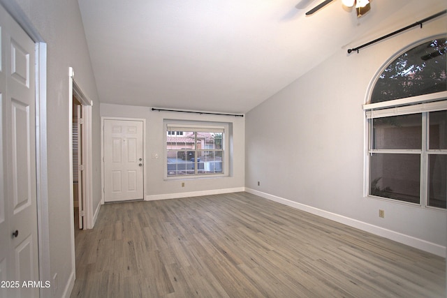 5941 W Venus Way, Chandler, AZ 85226 - unfurnished bedroom with vaulted ceiling, wood finished floors, baseboards, and ceiling fan