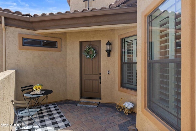 2145 N 88th St, Mesa, AZ 85207 - doorway to property featuring stucco siding and a tile roof