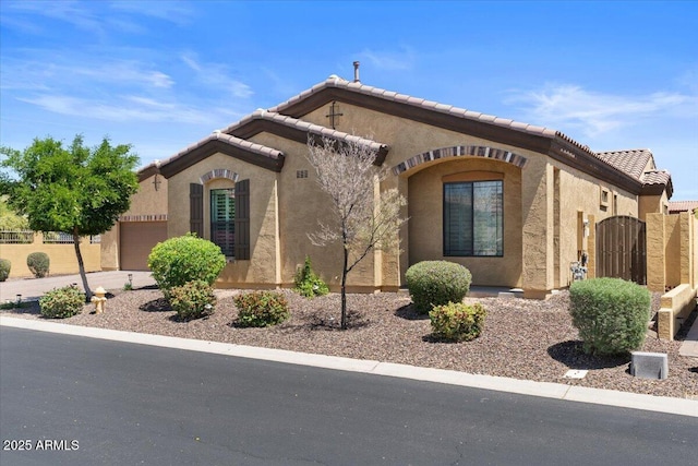 2145 N 88th St, Mesa, AZ 85207 - view of front of home featuring stucco siding, a tiled roof, a gate, fence, and a garage