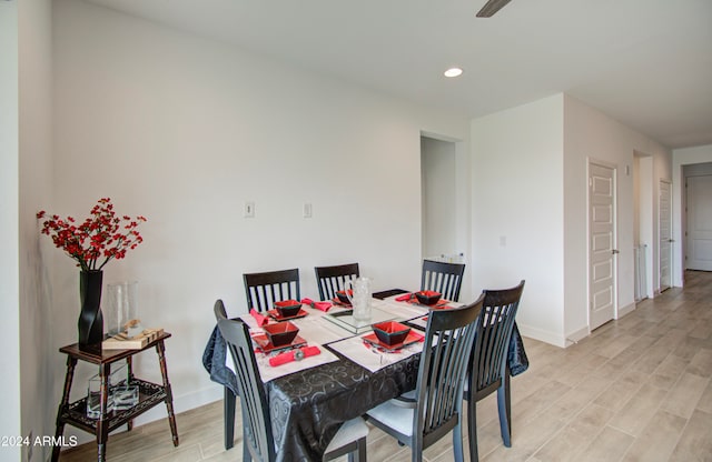 dining space featuring light wood-type flooring