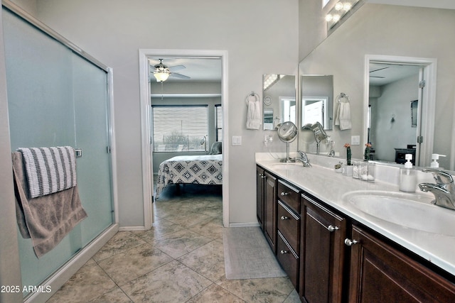 bathroom with a shower stall, connected bathroom, and a sink