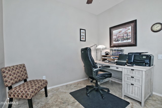 office area featuring a ceiling fan and baseboards