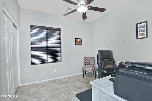 office space featuring visible vents, baseboards, and a ceiling fan