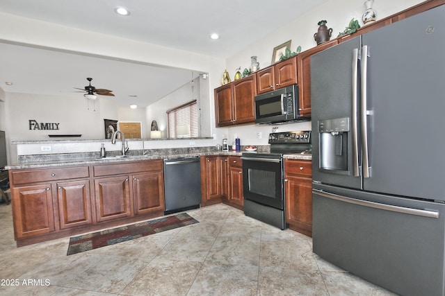 kitchen with recessed lighting, stone countertops, ceiling fan, a sink, and black appliances