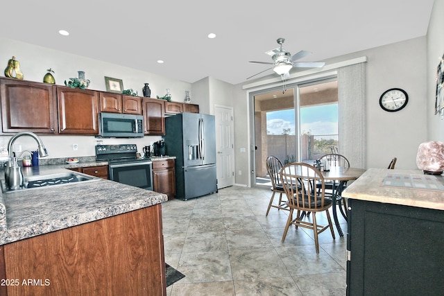 kitchen with a sink, appliances with stainless steel finishes, recessed lighting, and a ceiling fan