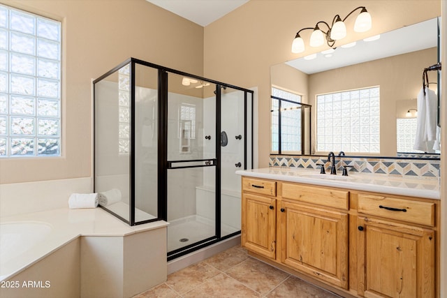 12976 W Plum Rd, Peoria, AZ 85383 - bathroom featuring tile patterned floors, tasteful backsplash, vanity, and a shower stall