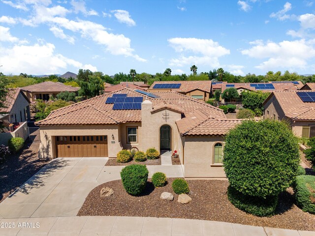 12976 W Plum Rd, Peoria, AZ 85383 - mediterranean / spanish home with a garage, stucco siding, a tile roof, and concrete driveway