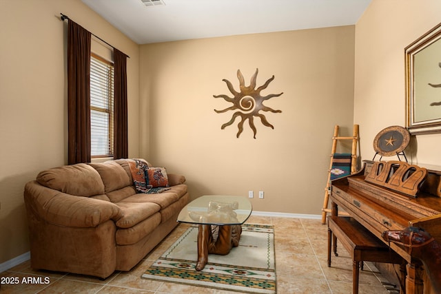 12976 W Plum Rd, Peoria, AZ 85383 - living room with light tile patterned floors, visible vents, and baseboards