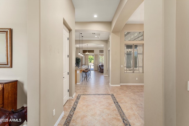 12976 W Plum Rd, Peoria, AZ 85383 - corridor featuring baseboards, recessed lighting, and an inviting chandelier