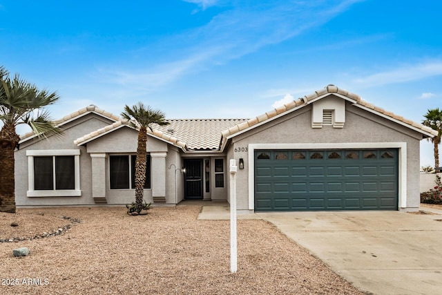 view of front of property featuring a garage