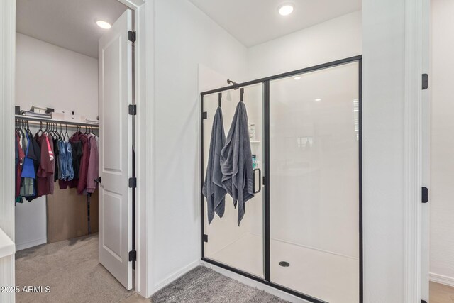 4514 W Hazel Ln, San Tan Valley, AZ 85144 - bathroom with a shower stall, a spacious closet, and baseboards