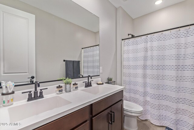 4514 W Hazel Ln, San Tan Valley, AZ 85144 - bathroom with toilet, double vanity, and recessed lighting
