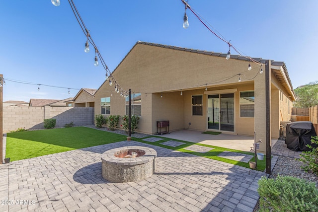 4514 W Hazel Ln, San Tan Valley, AZ 85144 - rear view of property with a fire pit, stucco siding, and a patio area
