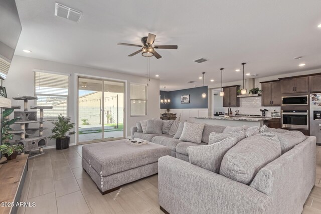 4514 W Hazel Ln, San Tan Valley, AZ 85144 - living room featuring a ceiling fan, wainscoting, and recessed lighting